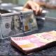 Nilai tukar rupiah tembus Rp 18.000 per Dollar AS [merdeka]